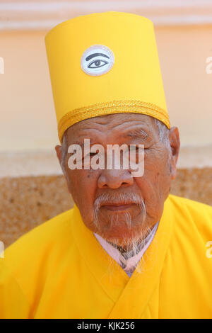 Cao Dai Holy See Temple.  Elederly priest.  Thay Ninh. Vietnam. Stock Photo