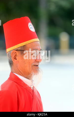 Cao Dai Holy See Temple.  Elederly priest.  Thay Ninh. Vietnam. Stock Photo