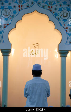 Masjid Al Rahim Mosque. Rear view of muslim man praying.  Ho Chi Minh City.  Vietnam. Stock Photo