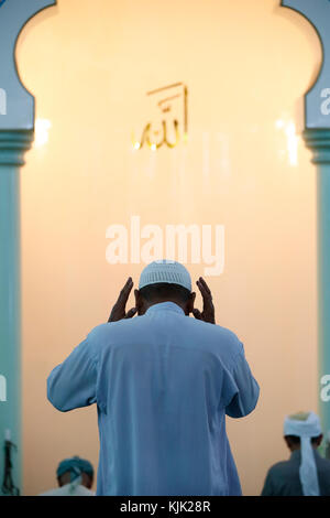 Masjid Al Rahim Mosque. Rear view of muslim man praying.  Ho Chi Minh City.  Vietnam. Stock Photo