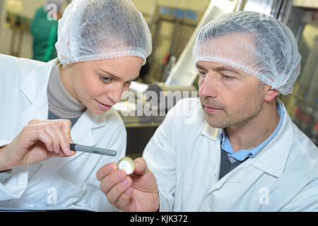 scientists working attentively in laboratory Stock Photo