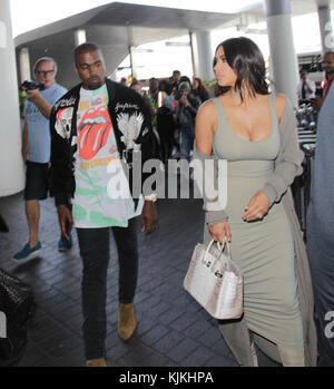 LOS ANGELES, CA - JUNE 12: Kim Kardashian and husband Kanye West are seen at Los Angeles International Airport (LAX) on June 12, 2016 in Los Angeles, California  People:  Kim Kardashian, Kanye West Stock Photo