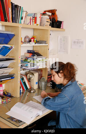 Schoolgirl doing homework. France. Stock Photo