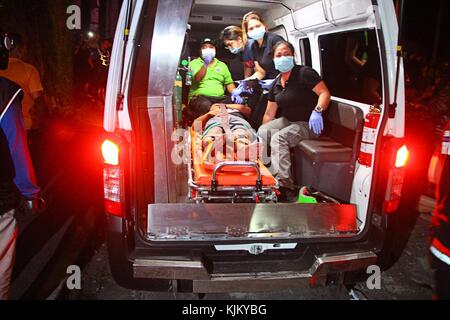 Philippines. 23rd Nov, 2017. Rescue team removed one of the two bodies of un-identified ten wheelers truck drivers who collided in a 5 commercial establishment and injured several stay-in employees after the driver out of controls of the heavy vehicle in-front of Maries Village, Marcos Highway in Antipolo City on the evening of November 23, 2017. They also damaged several vehicles on the highway before colliding with a commercial establishment. Credit: Gregorio B. Dantes Jr./Pacific Press/Alamy Live News Stock Photo