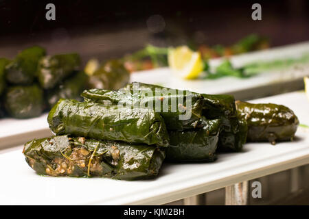 Traditional Turkish sarma from the rice with minced meat wrapped in grape leaves Stock Photo