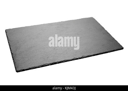 Empty black slate plate isolated on white background. Stock Photo