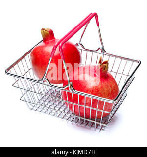 Pomegranate in shopping cart isolated on white. clipping path Stock Photo