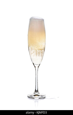 Glass of champagne with foam and bubbles on white Stock Photo