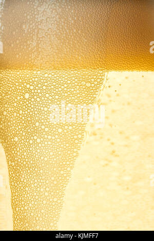 Closeup fo champagne foam and bubbles Stock Photo
