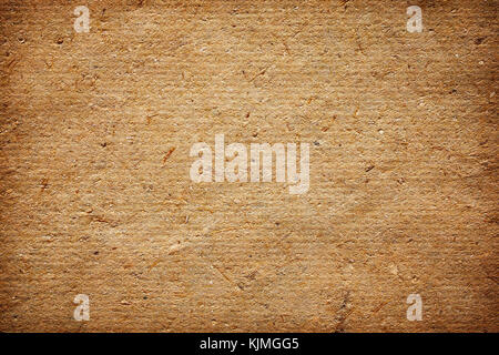 Natural handmade paper with visible plant fibers, texture or background. Stock Photo