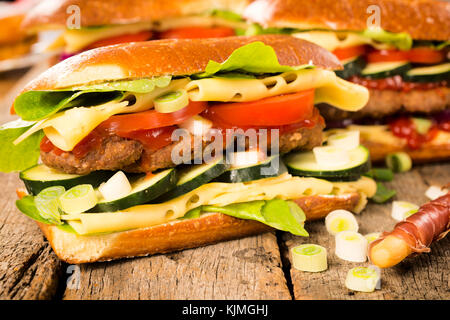 Big and tasty stuffed burger sandwich,selective focus Stock Photo