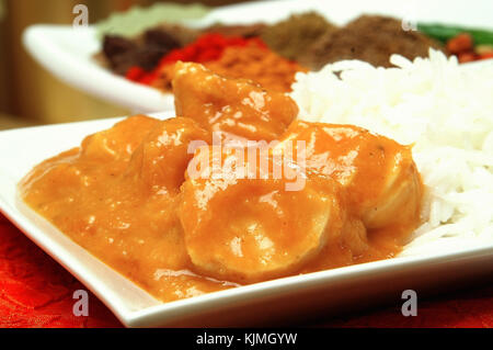 chicken korma with pilau rice on white Stock Photo