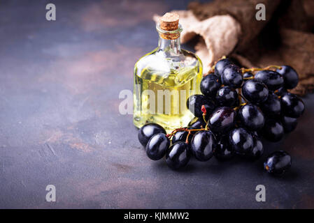 Grape seeds oil in small bottles Stock Photo