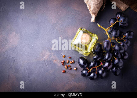 Grape seeds oil in small bottles Stock Photo