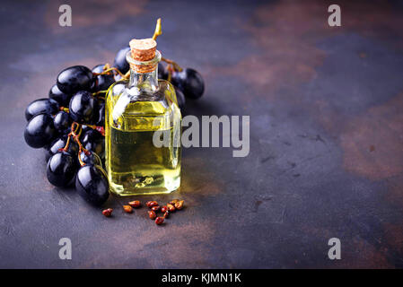 Grape seeds oil in small bottles Stock Photo