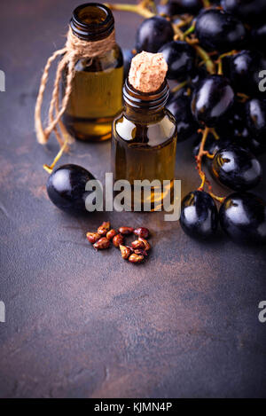 Grape seeds oil in small bottles Stock Photo