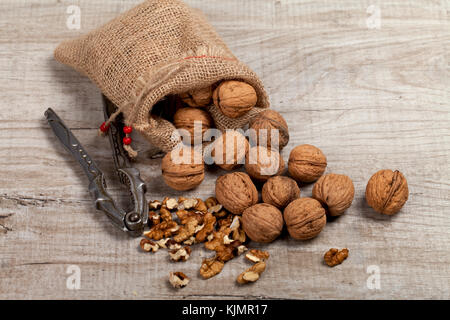 Whole walnuts, nut kernel on a wooden table Stock Photo