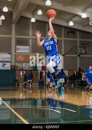 High school basketball action with Fall River vs. Loyalton in at the Shasta College Gym in Redding, California. Stock Photo