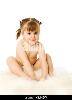 Toddler girl sitting wearing diaper isolated on white Stock Photo