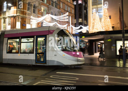 The Birmingham tram passes House of Fraser department store on Corporation Street at Christmas Stock Photo