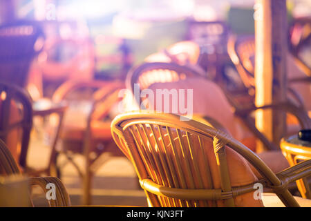 Outdoor cafes in coastline resort Kamari in Santorini Greece Stock Photo