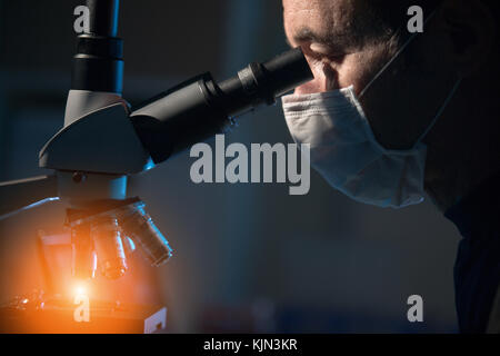 Doctor examines patient tissue samples Stock Photo