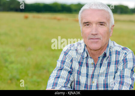 Portrait of mature man in field Stock Photo