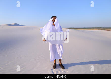 Serious young Arab businessman considering construction plan, st Stock Photo
