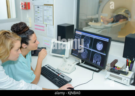 two medical specialists working together on computer Stock Photo