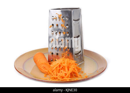 grater and carrots isolated on white Stock Photo