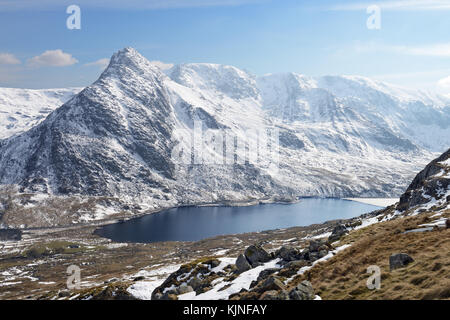Lake Ogwen is located in Snowdonia between the Carneddau and the Glyderau mountain ranges. It is a visually stunning so-called ribbon lake. Stock Photo