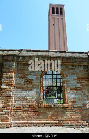 bell tower of church of Saint Elena in Venice Italy and an ancient Bricks wall Stock Photo