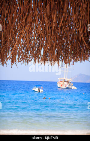 Yatch on calm sea water near coast Stock Photo