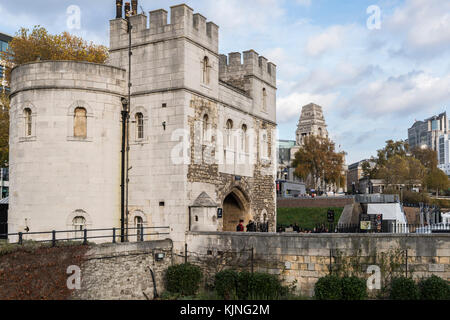 Tourists at entrance to Tower of London fort, a major touristic landmark, overlooking River Thames Stock Photo