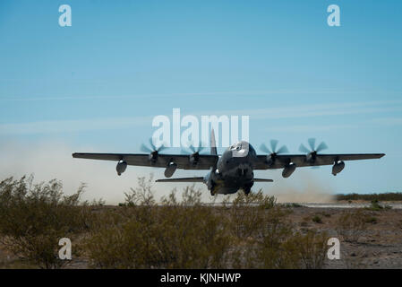 U.S. Air Force C-130 Hercules takes-off from an expeditionary runway set-up by U.S. Marines with Marine Air Control Squadron 1, Marine Air Traffic C Stock Photo