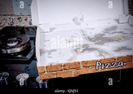 Empty pizza box with grease stains, a  fast food concept Stock Photo