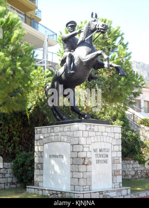 The 'Happy Turkey' statue of Ataturk on horseback taken in the harbour at Turunc, Turkey Stock Photo