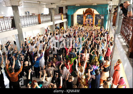 Crowd of Hare Krishna followers praying in a temple. April 3, 2017. The Krishna temple, Kyiv, Ukraine Stock Photo