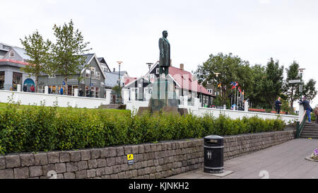 REYKJAVIC, ICELAND - SEPTEMBER 5, 2017: people near statue of Hannes Hafstein, he became the first minister of the country in 1904, in front of Govern Stock Photo