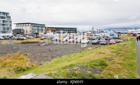 REYKJAVIC, ICELAND - SEPTEMBER 5, 2017: people and car parking on Hlesgata street near harbor in Reykjavik city in autumn. Reykjavik is the capital an Stock Photo