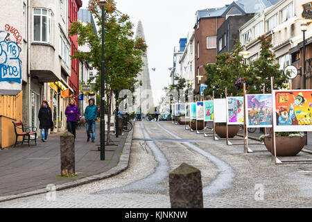 REYKJAVIC, ICELAND - SEPTEMBER 5, 2017: people on Skolavordustigur street and view of Hallgrimskirkja church in Reykjavik city in september. Reykjavik Stock Photo