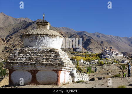 Young caucasian boy playing in front of a stupa with his mother, Likir Monastery or Likir Gompa, Likir, Ladakh, Jammu and Kashmir, India Stock Photo