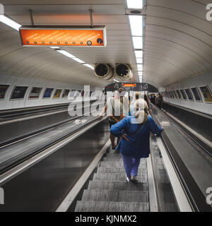 Underground transport users on the escalators in the Metro in Budapest (Hungary). June 2017. Square format. Stock Photo