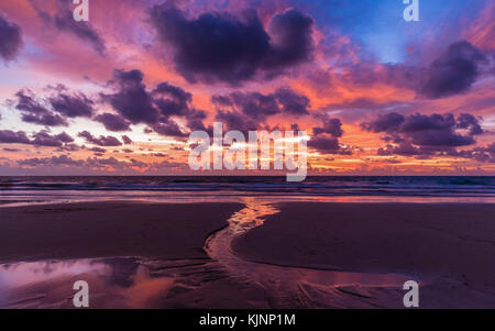 Dramatic cloudy sky in twilight covered sea and beach in Phuket, most attractive place of Thailand. Stock Photo