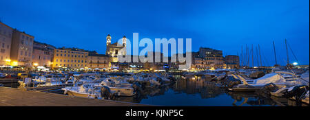 Corsica: the night skyline of Bastia, the city in the northeast, at the base of the Cap Corse, seen from the dock of the little port of the old town Stock Photo