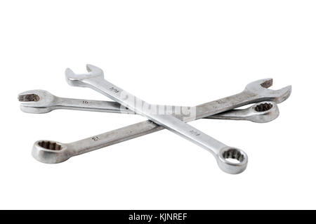 Three combination wrenches, metric and SAE on a white background. Stock Photo