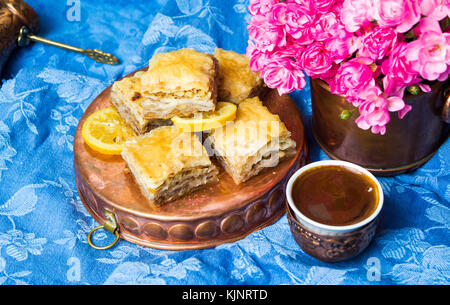 Baklava dessert with Turkish coffee in copper cups Stock Photo