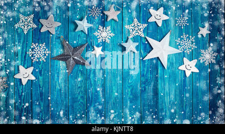 Christmas stars on wooden planks Stock Photo