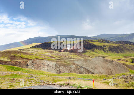 travel to Iceland - rainbow in mountains in Hveragerdi Hot Spring River Trail area in september Stock Photo