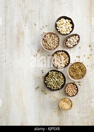 Pulses in bowls, overhead view. Stock Photo